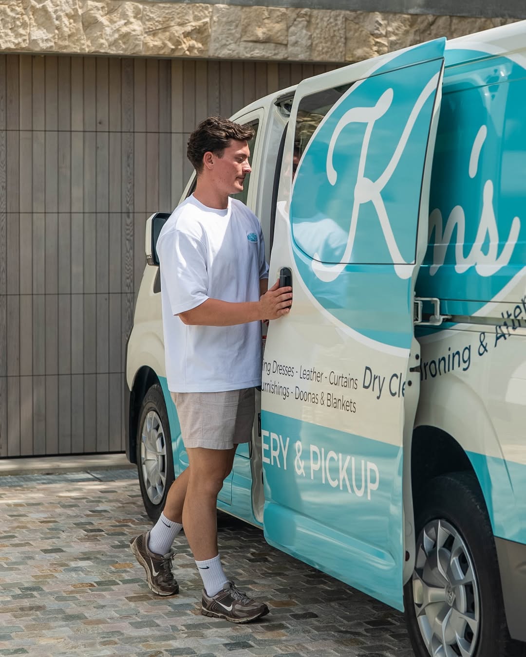 A member of the Kim’s team at the Kim’s Dry Cleaning delivery van